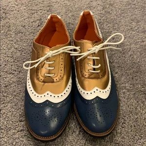 Navy, Gold and white saddle shoes.